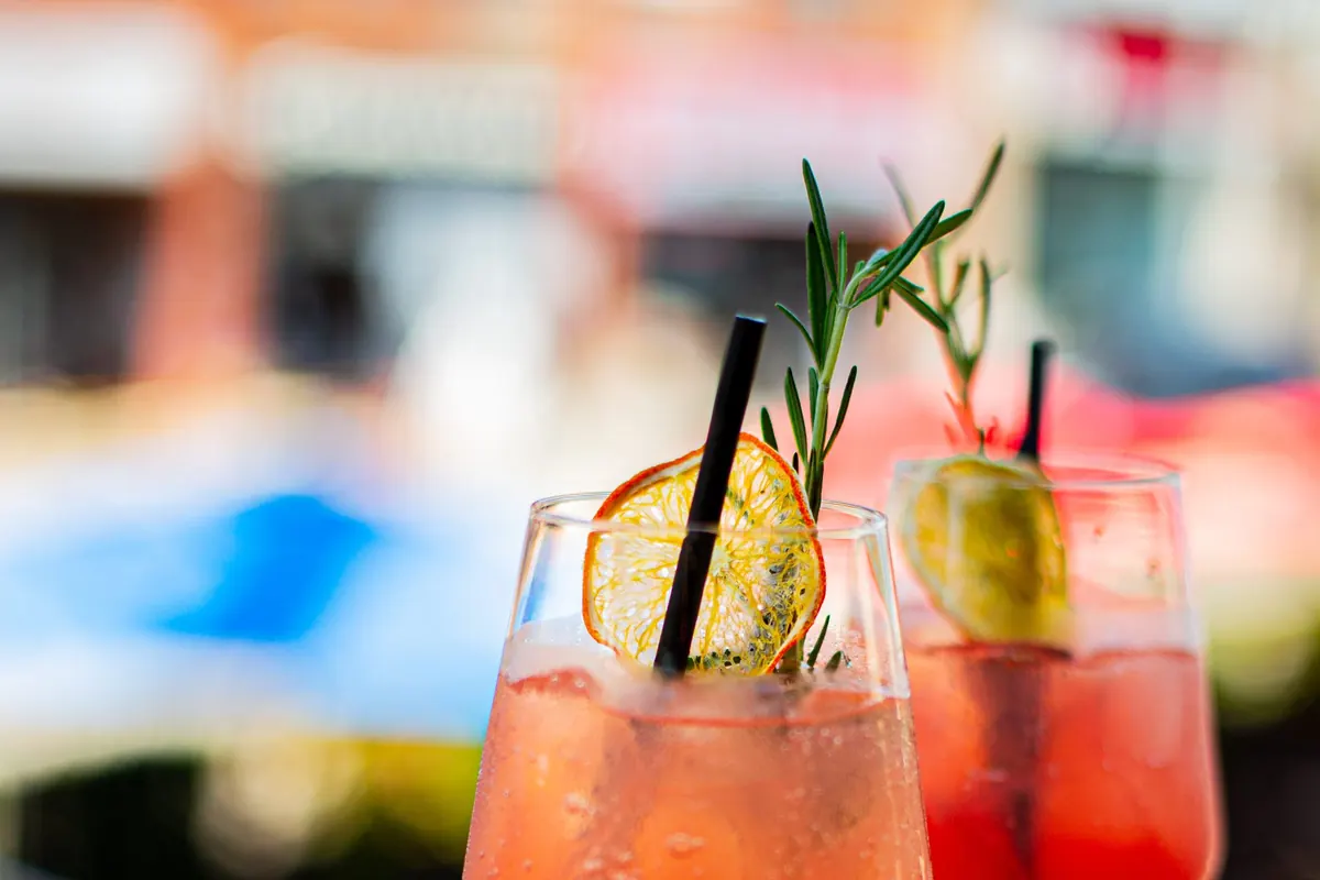 Two citrus-garnished spritz cocktails photographed for SLATE's cocktails page